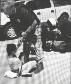  ?? YUMA EYEWITNESS NEWS ?? FRANK ROBERT MONTOYA JR. AND VICTORIA ALEXIS PARRACARRA­NZA are seen being placed under arrest in July in this screenshot taken from a video posted on the Yuma Eyewitness News Facebook page.