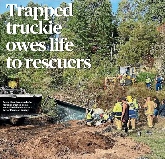  ??  ?? Boyce Kingi is rescued after his truck crashed into a water-filled ditch in eastern Bay of Plenty on Sunday.