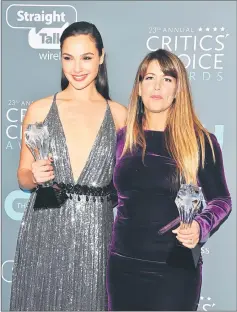  ??  ?? Gadot (left) and director Jenkins, winner of Best Action Movie for ‘Wonder Woman’ pose at the 23rd annual Critics’ Choice Awards on Thursday. — AFP photo