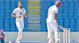  ??  ?? Suranga Lakmal (L) of Sri Lanka celebrates the dismissal of Nkrumah Bonner (R) of West Indies during day 1 of the 2nd Test between West Indies and Sri Lanka at Vivian Richards Cricket Stadium (AFP)