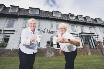  ??  ?? Park Manor Hotel staff Mags McNaught and Ali Lockwood make a toast with tea. 201960s