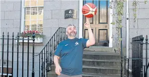  ??  ?? EYE ON THE BALL: Scotland basketball coach Jamie Leese shows his skills