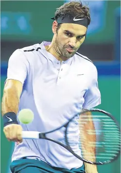  ?? Picture: Getty. ?? In control: Roger Federer took just one hour and 12 minutes for a straight-sets win over Rafael Nadal in the final of the Shanghai Masters.