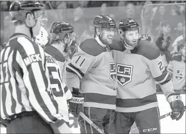  ?? Ringo H.W. Chiu Associated Press ?? THE KINGS’ Anze Kopitar (11) celebrates his goal with teammates in the second period of Saturday’s game.