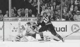  ?? JAMES GUILLORY USA TODAY NETWORK ?? Carolina Hurricanes left wing Jordan Martinook shoots against New York Rangers goaltender Igor Shesterkin during the second period of Game 4 of the second round of the Stanley Cup Playoffs on Saturday in Raleigh, North Carolina.