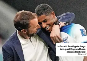  ?? Picture:: AP ?? Gareth Southgate hugs two-goal England hero Marcus Rashford