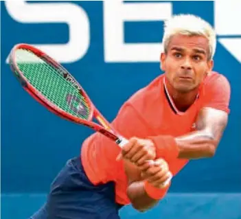  ??  ?? Sumit Nagal of India returns a shot to Bradley Klahn of USA during their first round match at the US Open tennis championsh­ips in New York on Tuesday. Nagal won 6- 1, 6- 3, 3- 6, 6- 1.