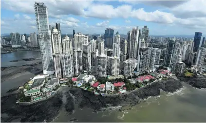  ?? Rodrigo Arangua / AFP ?? Panama City is in the spotlight after a year-long investigat­ion into 11.5 million leaked documents taken from the law firm Mossack Fonseca. The leaks exposed some high-profile tax evasion and money laundering among the world’s elite.