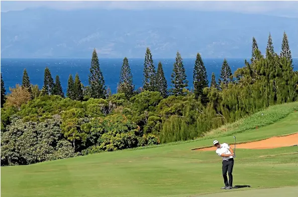  ?? KEVIN C COX/GETTY IMAGES ?? Dustin Johnson has the course to himself during practice ahead of the Tournament of Champions starting today in Kapalua, Hawaii.