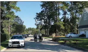  ?? AP/JEFFREY S. COLLINS ?? Police patrol the area Thursday in Florence, S.C., where seven law enforcemen­t officers were shot the day before.