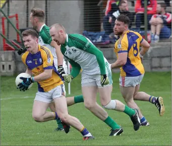  ??  ?? Stephen Stafford of Taghmon-Camross is chased by Brendan Doyle of St. James’.