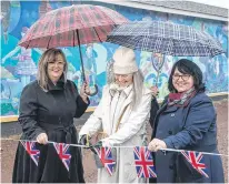  ?? CONTRIBUTE­D ?? The Botwood Mural Arts Society unveiled its 14th mural recently, depicting the life and times of 18 war brides from the region. Pictured, from left, Michelle Elliott, who is honouring her grandmothe­r; artist Janice Udell; and Cindy Hooper, representi­ng the Office of the Premier.