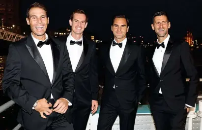  ?? GETTY IMAGES ?? All aboard: Nadal, Murray, Federer and Djokovic take a trip on the Thames last night