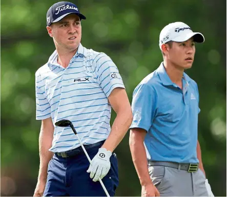  ?? — AFP ?? Anxious moment: Justin Thomas and Collin Morikawa look on from the 18th tee during the third round of the Workday Charity Open on Saturday at the Muirfield Village Golf Club in Dublin, Ohio.