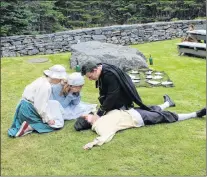  ?? SAM MCNEISH/THE TELEGRAM ?? Fisherman Jean Pichot (Liam Ryan) was killed following an argument with a drunken basque, in a scene from the “Faces of Fort Royal” performanc­e which concluded its 2018 season at Castle Hill National Historic Site on Friday. Also shown in the scene are (from left) his daughter Therese Pichot (Katie Hann), his wife Madeline Pichot (Paula Milley) and given his last rights after checking for a pulse by Father Jean Boudain (Darren Ivany).