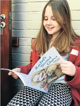  ?? ?? Rachel Ancer with the book she wrote a year after her bone marrow transplant.