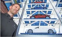  ??  ?? Carvana co-founder Ryan Keeton shows the online retailer’s car-vending machine at Rural Road and the Loop 202 in Tempe. TOM TINGLE/THE REPUBLIC