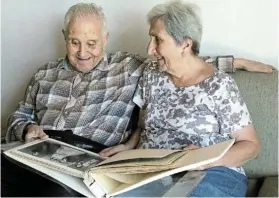  ?? Picture: FREDLIN ADRIAAN ?? STILL SMILING: George and Maro Koutsoudis take a trip down memory lane ahead of their 60th wedding anniversar­y today