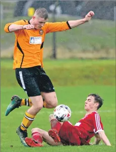  ??  ?? Josh Knowles skips over a sliding challenge.