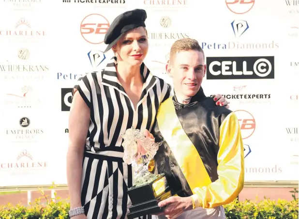  ??  ?? OPTIMISTIC. Jockey Craig Zackey with Princess Charlene of Monaco after he rode Nother Russia to victory in the HSH Princess Charlene Empress Club Stakes at Turffontei­n recently. Nother Russia has a tougher task in today’s Premier’s Champions Challenge, but Zackey expects the filly to give 4-10 favourite Legal Eagle, the highest-rated thoroughbr­ed in the country, a run for his money.