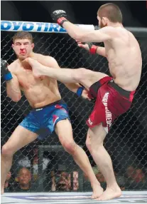  ?? AP PHOTO/FRANK FRANKLIN II ?? PERFECT HIT. Russia’s Khabib Nurmagomed­ov connects on a kick on Al Iaquinta in UFC 223.