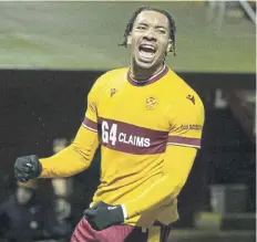  ?? ?? Theo Bair celebrates scoring a penalty to put Motherwell 3-0 up