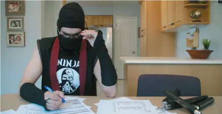  ?? HANDOUT IMAGE ?? The Ninja (played by Jeremy Abbott) takes care of some paperwork in a scene from Geoff &amp; The Ninja. Six episodes of the locally-produced series will debut on Telus Optik TV in October. A launch party will be held at the Prince George Playhouse on Saturday at 7 p.m.