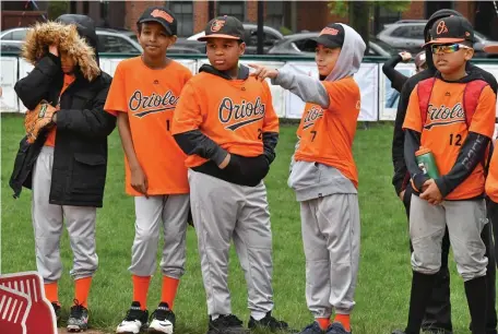  ?? CHRIS CHRISTO / HERald STaFF FIlE ?? SWING AND MISS: Little Leaguers wait for the festivitie­s to begin during the South End Little League Opening Day ceremonies at Peter’s Park in Boston on May 4, 2019.