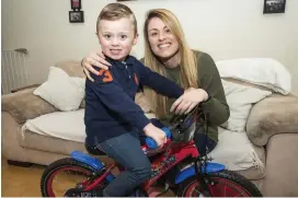  ??  ?? Tadhg Fearon with his mother Alison, who is urging people to get involved in the Santa Cycle fundraiser for the Straight Ahead charity. Photo: Doug O’Connor