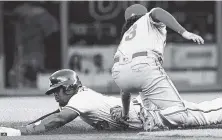  ?? THE ASSOCIATED PRESS ?? The Atlanta Braves’ Brandon Phillips is caught stealing second base as Philadelph­ia Phillies shortstop Freddy Galvis makes the tag Wednesday in Atlanta. The Phillies won 3-2.