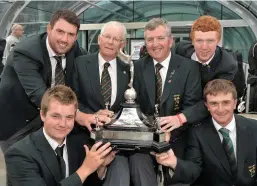  ??  ?? Team Captain Padraig Hogan and selector Tony Goode with Richard Bridges, Jack Hume, Gavin Moynihan and Paul Dunne with the Raymond Trophy after victory in the Home Internatio­nals. Picture: Pat Cashman