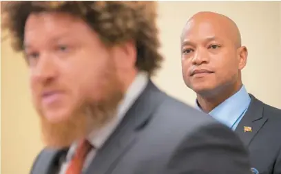  ?? KARL MERTON FERRON/BALTIMORE SUN ?? Maryland Gov.-elect Wes Moore stands Monday behind Fagan Harris, who will be his chief of staff.