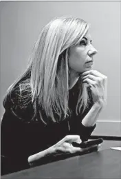  ?? ABEL URIBE/CHICAGO TRIBUNE ?? Anita Erickson, who is seeking a job, sits with Mike Munger of Career Transition­s Center as she prepares on Thursday for potential video interviews.