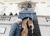  ?? CZAREK SOKOLOWSKI/AP ?? A woman’s rights activist holds a sign saying “no” at a church to protest abortion restrictio­ns inWarsaw, Poland.