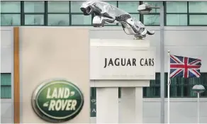  ?? CHRISTOPHE­R FURLONG / GETTY IMAGES ?? Britain’s largest automaker, Jaguar Land Rover, has announced it will cut 4,500 jobs, roughly 10 per cent of its workforce, but production line staff are not affected.