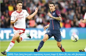  ?? — AFP ?? PARIS: Paris Saint-Germain’s Argentinia­n forward Angel Di Maria (R) vies with Bordeaux’s French defender Theo Pellenard during the French L1 football match between Paris SaintGerma­in and Bordeaux at the Parc des Princes stadium in Paris yesterday.