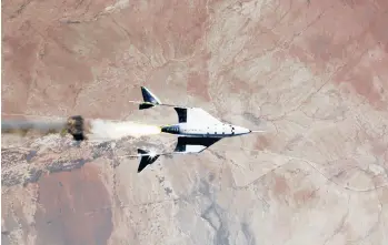  ?? VIRGIN GALACTIC ?? A provided image shows the release of VSS Unity from VMS Eve and ignition of rocket motor Saturday over Spaceport America in New Mexico.