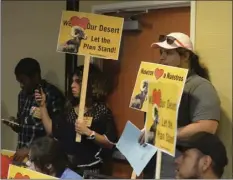  ?? PHOTO ?? Supporters of the Desert Renewable Energy Conservati­on Plan brought picket signs to show their desire for the plan to remain intact. EDWIN DELGADO