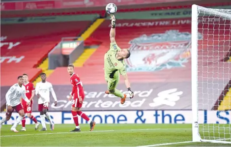  ??  ?? Leno (right) makes a save during the English League Cup fourth round football match between Liverpool and Arsenal at Anfield in Liverpool, north west England. - AFP photo