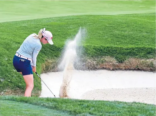  ??  ?? SANDSTORM: Not a good day for overnight leader Paula Creamer who dropped 12 shots down the field