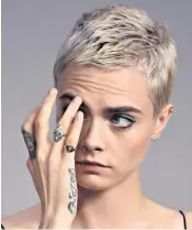  ??  ?? Finger on the pulse: Stars such as Cara Delevingne, left, and Rosie Huntington­whiteley, above, have worn signet rings on their little fingers of late