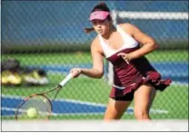  ?? PETE BANNAN — DIGITAL FIRST MEDIA ?? Henderson’s Emma Clark hits a shot during her match against Sophia Sassoli of Harriton Tuesday at Plymouth Whitemarsh.