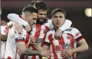  ?? STU FORSTER - POOL, POOL GETTY ?? Sheffield United’s Billy Sharp, left, celebrates after scoring his side’s first goal during the English Premier League soccer match between Sheffield United and Newcastle United, Tuesday, Jan. 12, 2021.