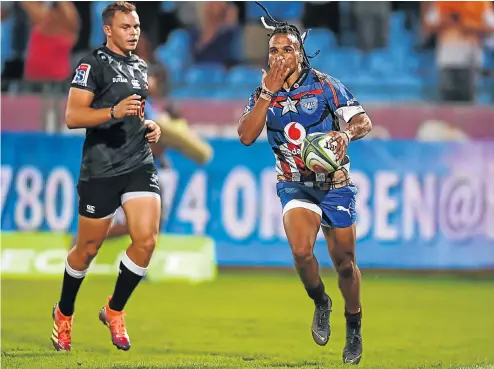  ?? Anton Geyser/Gallo Images Picture: ?? Rosko Specman of the Vodacom Bulls scores a try during the Super Rugby match between Vodacom Blue Bulls and Cell C Sharks at Loftus Versfeld in Pretoria yesterday.