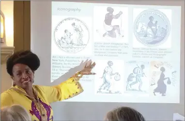  ?? EVAN BRANDT — MEDIANEWS GROUP ?? West Chester University history professor Tonya Thames Taylor shows how iconograph­y in the time of slavery portrayed African-Americans as helpless or fleeing.