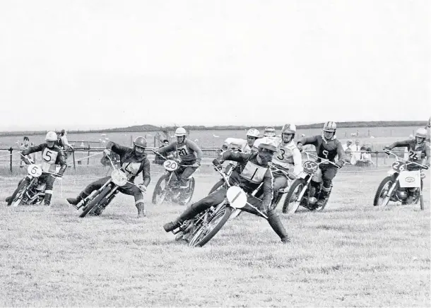  ??  ?? HIGH-SPEED ACTION: Into the first bend in the final of the unlimited event at Bon Accord Motor Cycle Club Grass Track Championsh­ips in August 1967