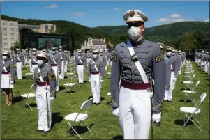  ?? The Associated Press ?? COMMENCEME­NT CEREMONY: United States Military Academy graduating cadets wear face masks as they stand next to their socially-distanced seats during commenceme­nt ceremonies Saturday in West Point, N.Y. President Donald Trump’s commenceme­nt speech to the 1,100 graduating cadets during a global pandemic comes as arguments rage over his threat to use American troops on U.S. soil to quell protests stemming from the killing of George Floyd by a Minneapoli­s police officer.