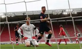  ??  ?? Timo Werner of RB Leipzig celebrates the second goal of his hat-trick during RB Leipzig’s thrashing of Mainz. Photograph: Kai Pfaffenbac­h/Getty Images