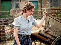  ??  ?? The luminous Lily James stars as Juliet Ashton in The Guernsey Literary and Potato Peel Pie Society.