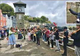  ?? ?? Fiddle player and composer Patsy Reid 'busking' with young people taking part in last year's Mull Fiddle Week. Inset: Multi-instrument­alist and composer Hamish Napier will be at Dervaig Village Hall on Saturday April 2.